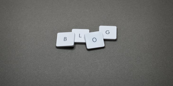An arrangement of letter tiles spelling "blog."