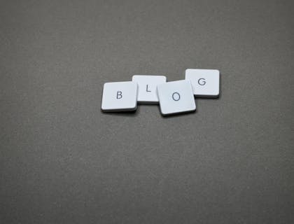 An arrangement of letter tiles spelling "blog."