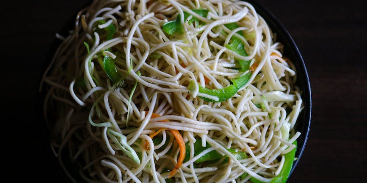 bowl of noodles with green peppers