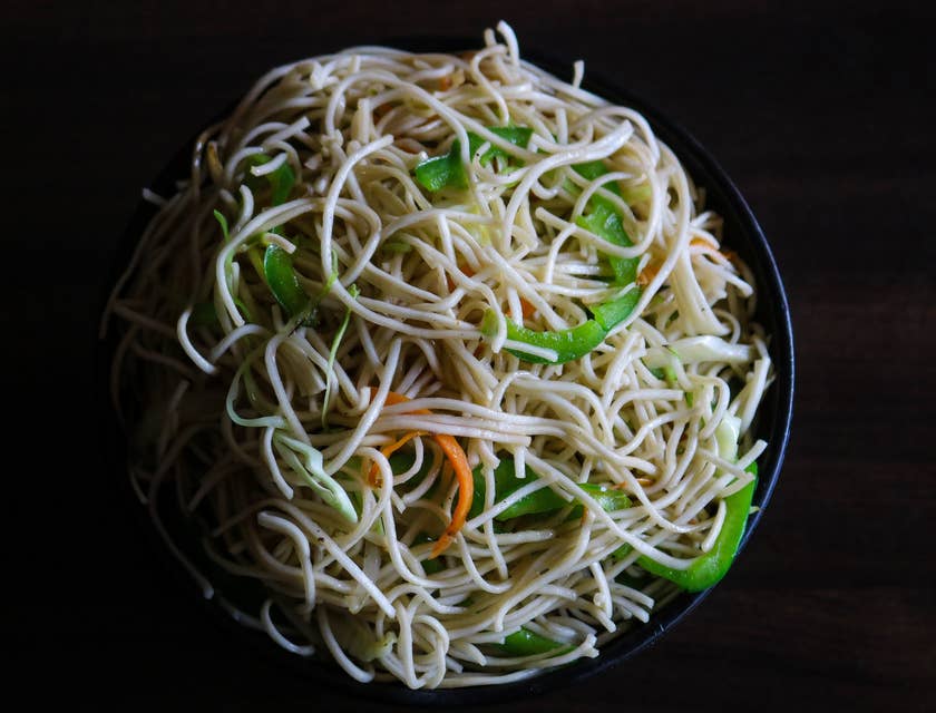bowl of noodles with green peppers