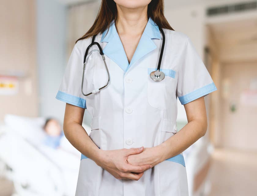 A woman standing in a nursing business.