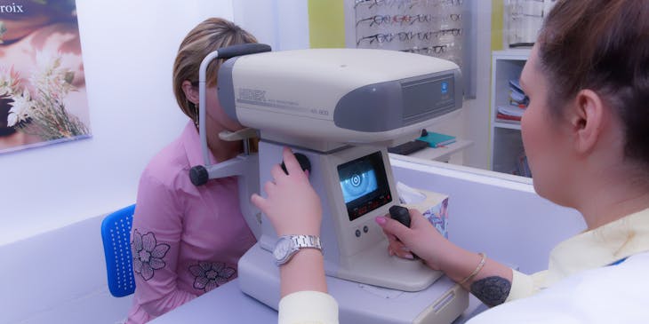 Woman having her eyes tested by an optometrist.