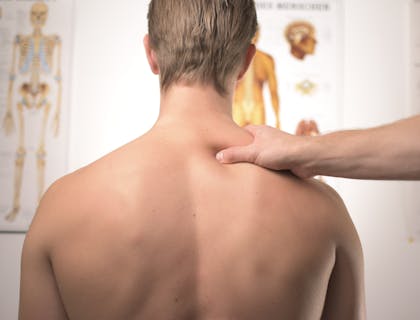 Orthopedist checking woman's joints.