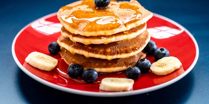 Blueberry pancakes with syrup.