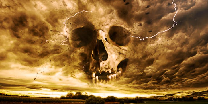 paranormal skull in the clouds over an open road