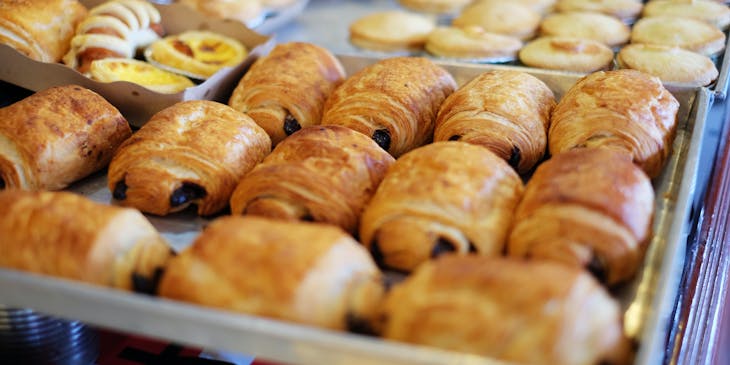 A pastry dessert placed on a plate with a fork