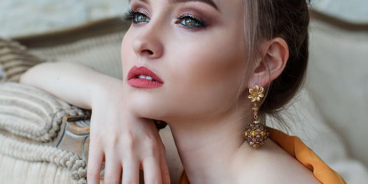 A woman with permanent makeup posing for a picture.