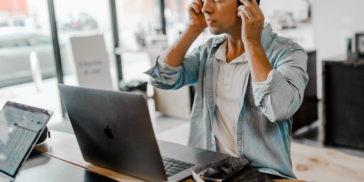A personal assistant taking a call with his headset