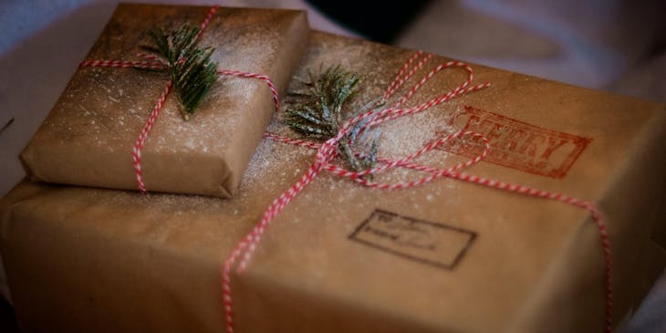 A personalized gift wrapped in butcher paper and twine.