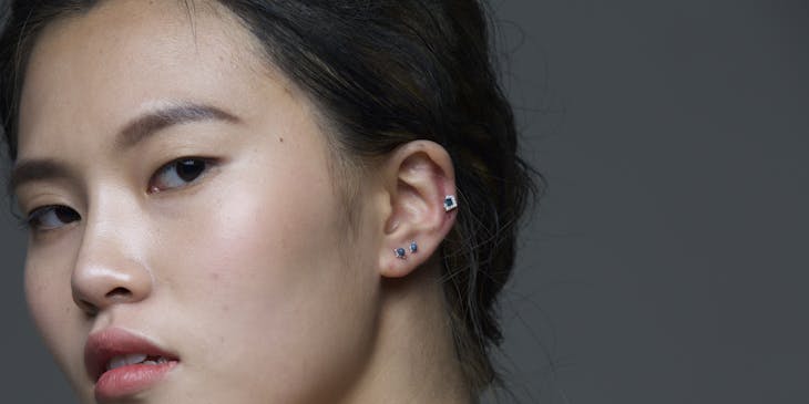 Asian model showing ear piercing.
