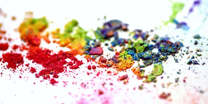 Colored powders on white canvas.
