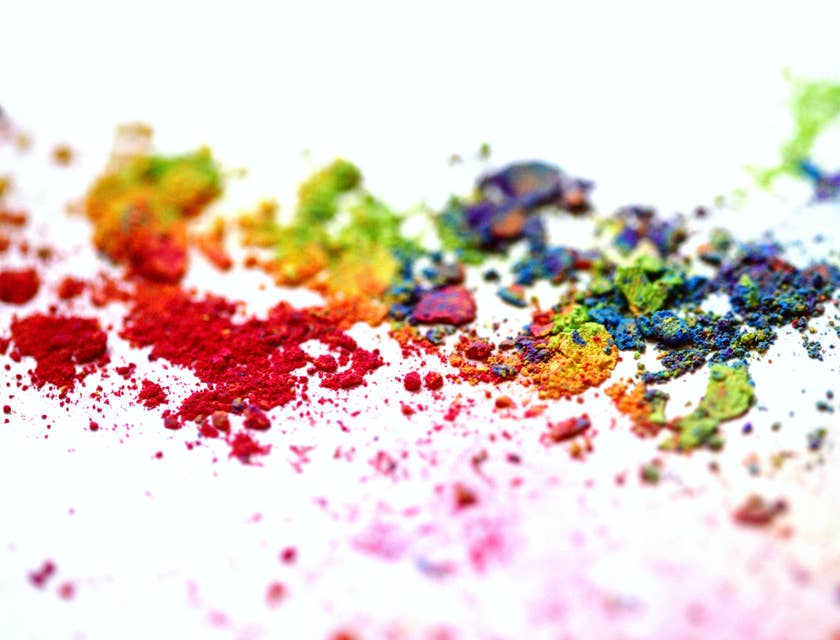 Colored powders on white canvas.