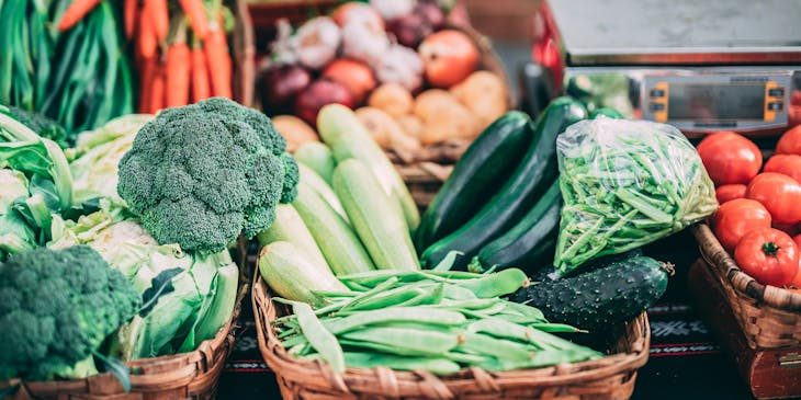 Fresh produce in baskets on a table.
