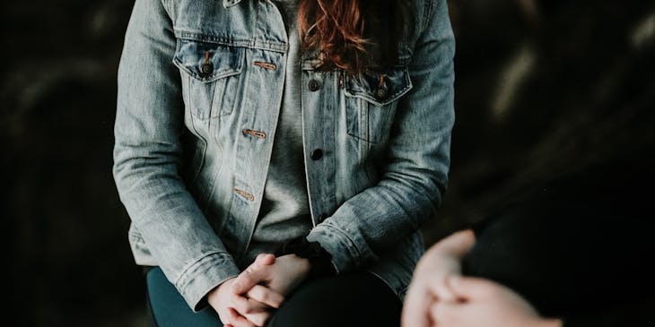 Woman sitting and talking to a psychiatrist.