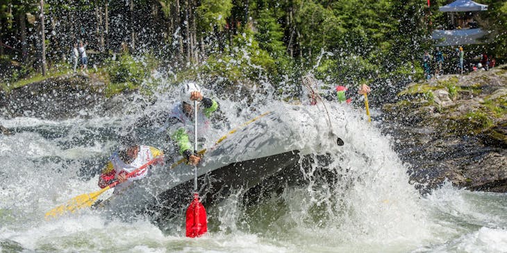 Group of people enjoying a rafting and kayaking adventure.