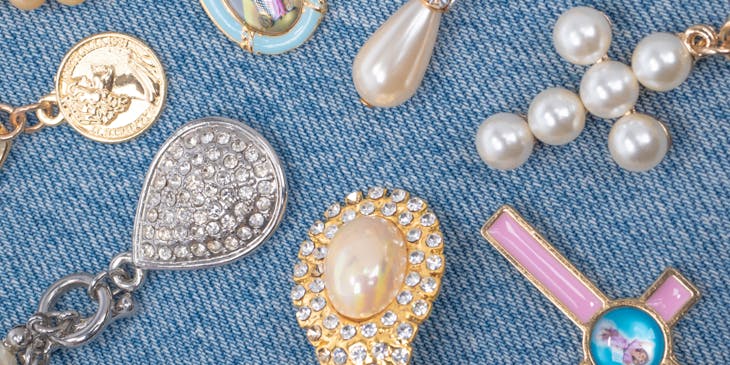 A collection of religious jewelry on a denim background.
