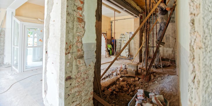 A team of workers remodeling a building.