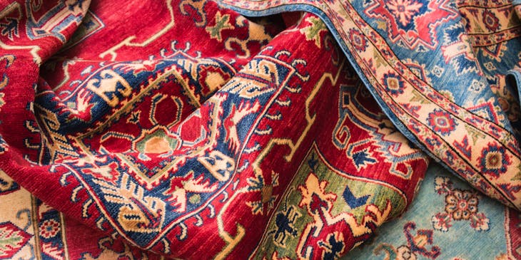 Several rugs piled on the floor.