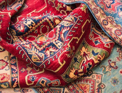 Several rugs piled on the floor.