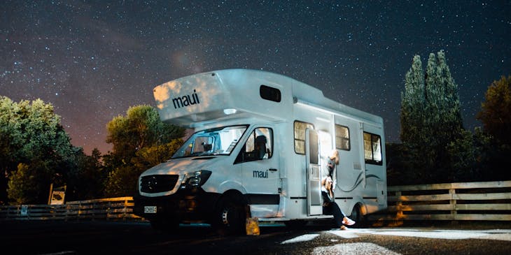 A family in an RV under the stars.