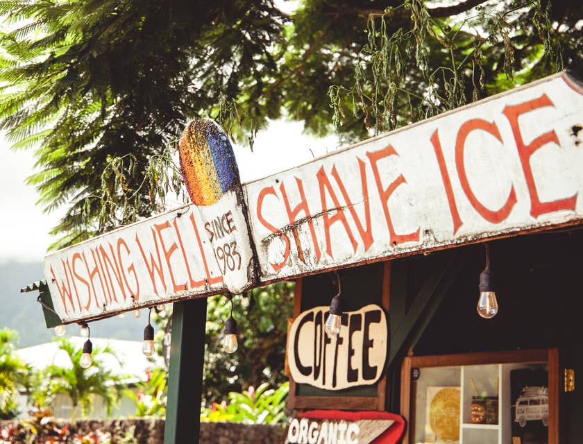 Shaved ice stand in a sunny outdoor area.