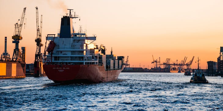 ship leaving a shipping business port