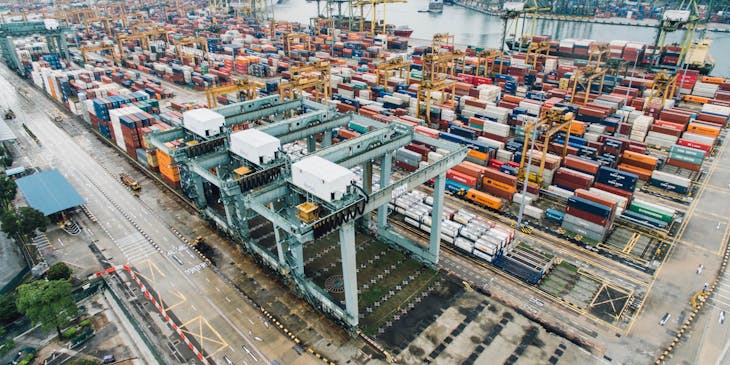 Large shipping center dock filled with storage containers.