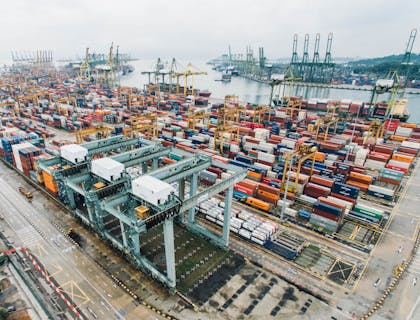 Large shipping center dock filled with storage containers.