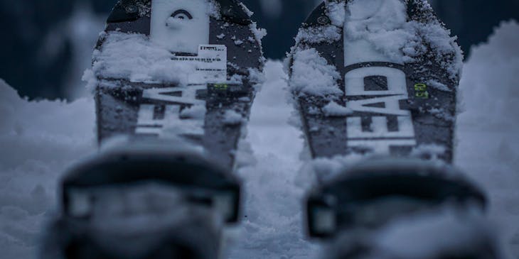 Two skis placed on a snowy slope.