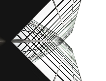 A sleek and modern building viewed from below.