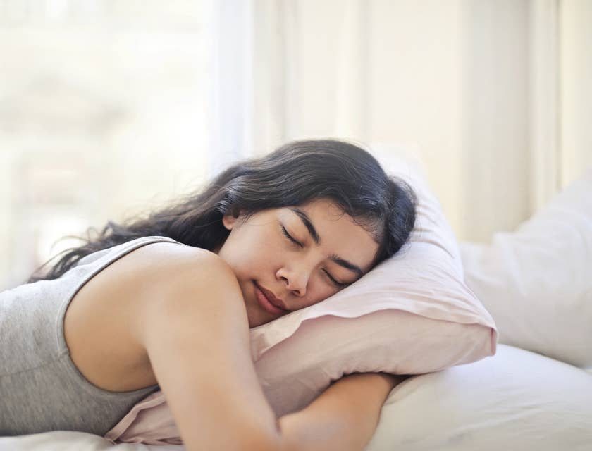 A woman sleeping well after working with a sleep specialist.
