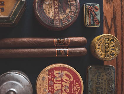 Various tobacco products being displayed in a smoke shop.