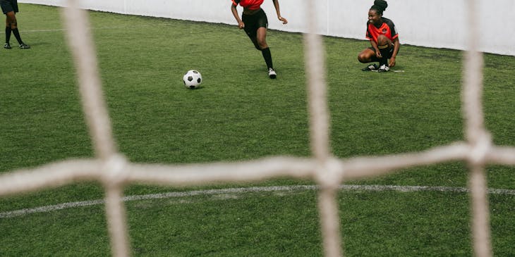 Girls playing soccer.