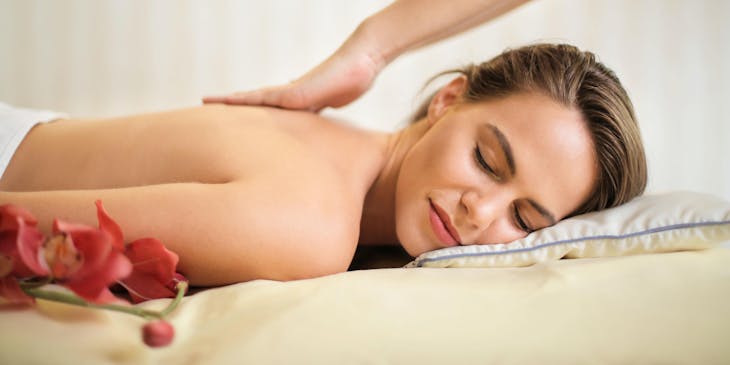 A client at a spa receiving a massage treatment.