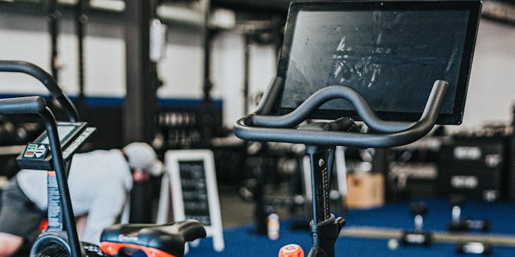 A spin bicycle in a gym with a spin class business.