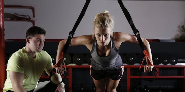 Sports medicine professional working with an athlete.
