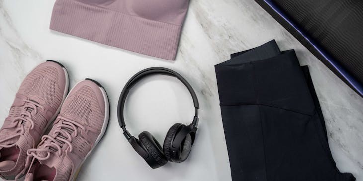 Sportswear business products, including athletic wear, a sports mat, and headphones.