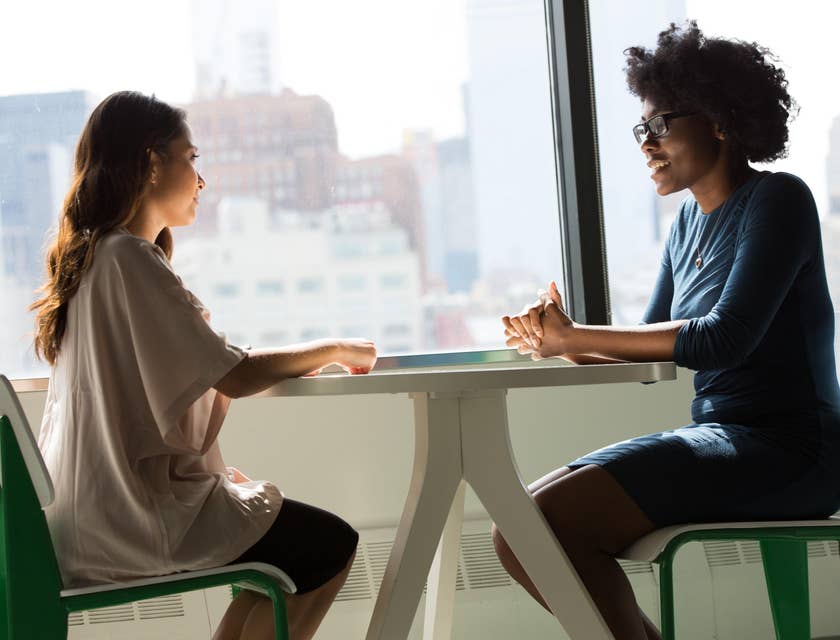 Two women having a meeting at a staffing agency.