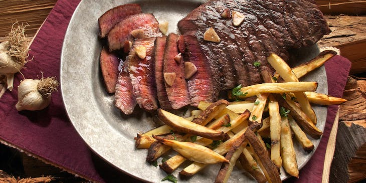 Steak and fries served at a steakhouse.