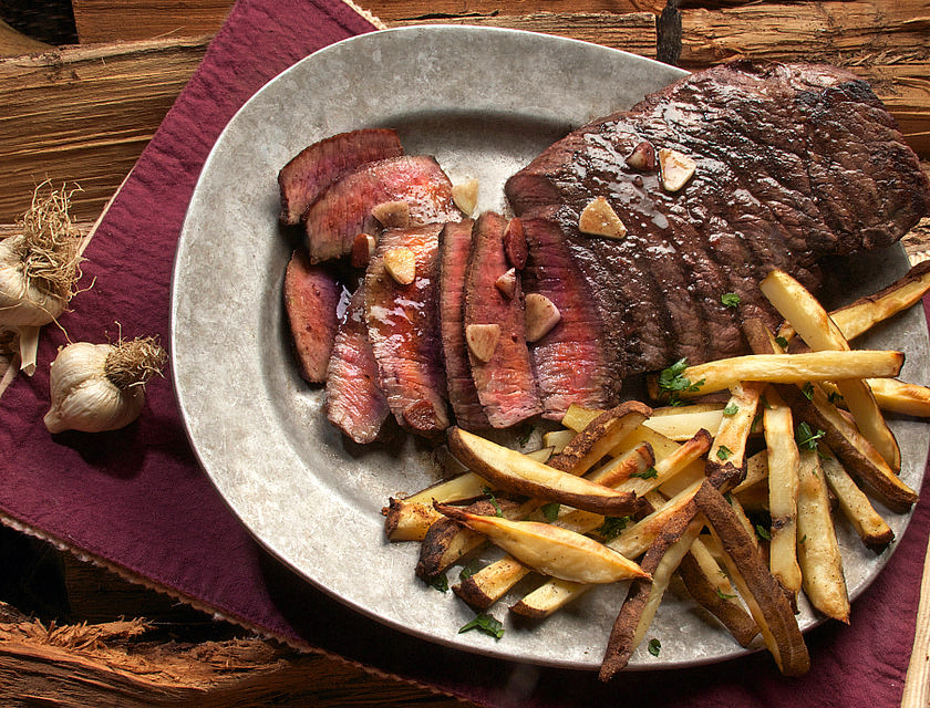 Steak and fries served at a steakhouse.