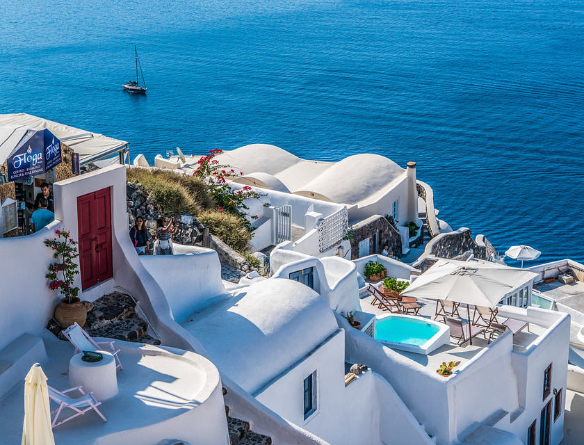 A stucco plastered buildings overlooking the ocean.