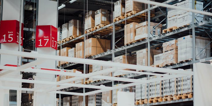 Warehouse with boxes on shelves at a supply business.