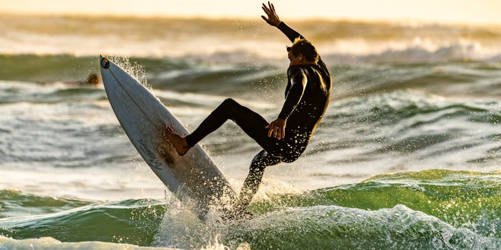 Man out for a surf on a surfboard