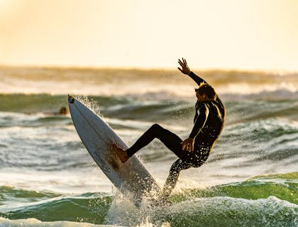 Man out for a surf on a surfboard