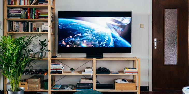 A movie starting on a television screen.