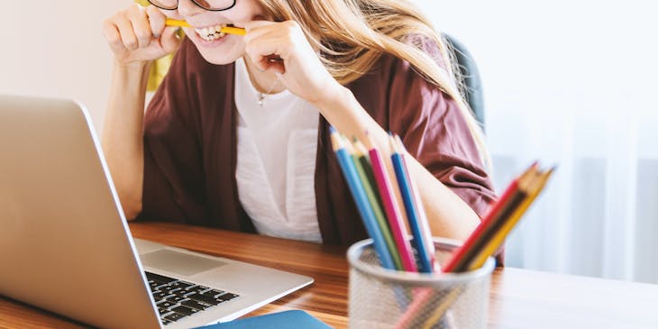 A woman stressing over test preparation.
