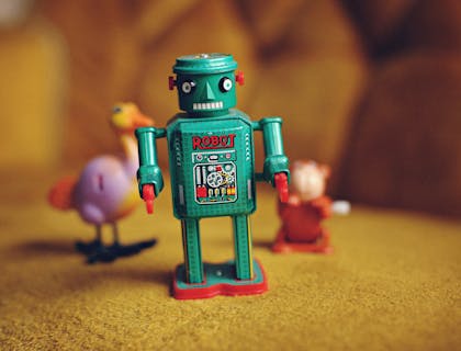 Toy robot on a yellow surface at a toy business.