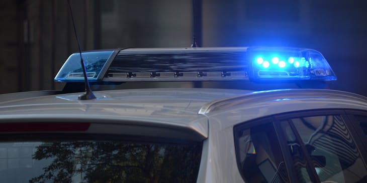 A police car during a traffic ticketing stop.