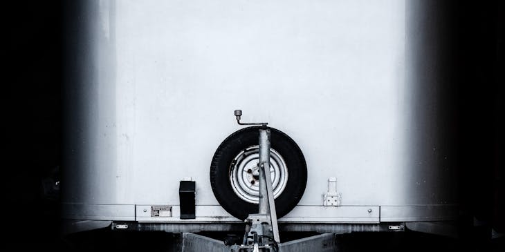 Black and white image of a trailer and hitch.