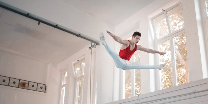 A man jumping with white background.